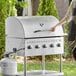 a person holding a grill