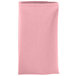 A folded pink Intedge cloth napkin.