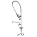 A chrome Equip by T&S deck mounted pre-rinse faucet with flex inlets and a hose.