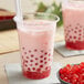 A pink bubble tea with Fanale Cherry Popping Boba on a white background.