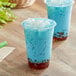 Two cups of blue Fanale Lychee Jelly topping in a plastic drink.