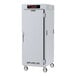 A stainless steel Metro C5 heated holding cabinet with full solid doors and wheels.