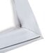 A white vinyl magnetic door gasket with a metal clip.