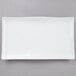 A white rectangular plate with a wavy edge.