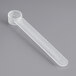 A clear plastic container with a long-handled plastic scoop inside.