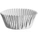 A silver foil cupcake liner with a white paper exterior.