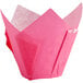 A white background with a pink paper wrapper with a folded edge.