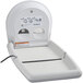 A Koala Kare white granite vertical surface-mounted baby changing table.