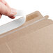 A person holding a Lavex Stayflats label.