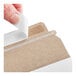 A white self-sealing rigid mailer with a peel-and-seal adhesive strip being opened.