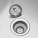 A Regency stainless steel three compartment sink with drains.