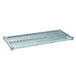 A MetroMax Q metal shelf with a grey plastic grate.