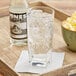 A tray with a glass of Jones Cream Soda and a bowl of popcorn.