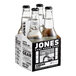 A Jones Cream Soda glass bottle with white liquid in it.