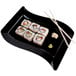 A Fineline black plastic salad plate with sushi and chopsticks on it.