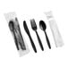 A wrapped cutlery kit containing a black plastic fork, knife, spoon, napkin, and packets of salt and pepper.