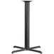 A black metal bar height table base with a cylindrical column and four legs.