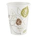 A white Dixie paper hot cup with a leaf design.
