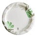 A Dixie Ultra paper plate with a green and white floral design.
