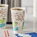 Two Dixie paper coffee cups on a table.