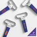 A set of chrome-plated two-prong cork extractors with customizable dark blue sheaths.