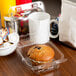 A muffin in a Durable Packaging clear hinged plastic container.