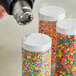 1" clear perforated shrink band on a jar of colorful candies.