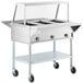 A ServIt stainless steel open well electric steam table on wheels.