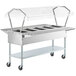 A ServIt open well electric steam table with a clear sneeze guard on casters.