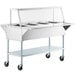 A ServIt open well stainless steel electric steam table on wheels.