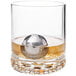 A glass with a Franmara stainless steel ice sphere inside it.