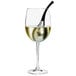 A close-up of a wine glass with a Franmara stainless steel ice bell in it.