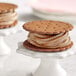 A brown cookie sandwich with Creamery Ave. Espresso soft serve inside.