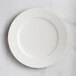 A RAK Porcelain Leon ivory porcelain plate with wavy lines on the rim.