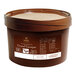 A brown bucket of Cacao Barry Grand Caraque Cocoa Mass.