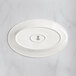 A RAK Porcelain ivory porcelain oval plate with an embossed oval design.