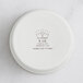 A white round RAK Porcelain ramekin with embossed text.