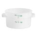A white round plastic container with green measurements on the side.