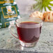 A glass of Crown Royal Reserve Sumatra Decaf Coffee with steam.
