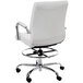 A white office chair with chrome legs and wheels.