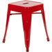 A Flash Furniture red metal backless stool with legs.