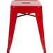 a red stool with legs