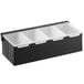 A matte black stainless steel condiment bar with four compartments.