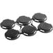 A black plastic PakTech can carrier with six round circles.