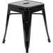 A Flash Furniture black metal backless outdoor restaurant bar stool.