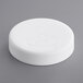 A white circular child-resistant cap with a pictorial logo on it.
