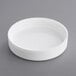 A white plastic container with a white child-resistant cap on a gray surface.