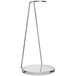 A Decantus table stand with a metal base and glass top.
