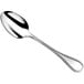 A Couzon by Amefa Le Perle stainless steel serving spoon with a beaded handle and silver spoon.