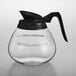 a glass coffee pot with a black handle